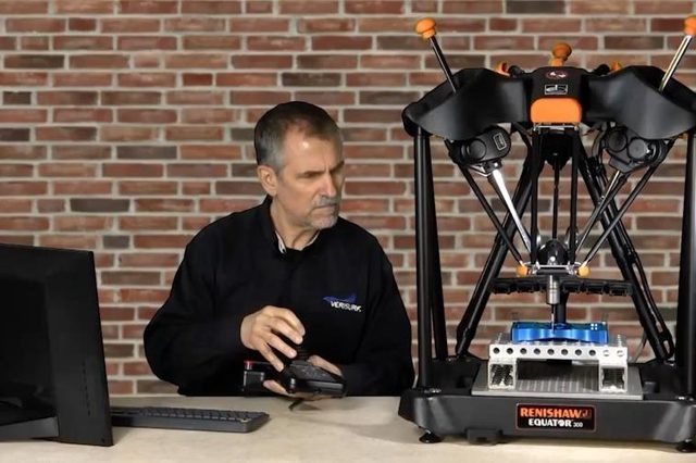 A Renishaw Equator 300 comparative gauge standing on a bench, loaded
                      with a fixture plate of machined parts, operated from a handset by a
                      technician at a monitor.